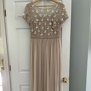 Beautiful embellished gown by Adrianna Papell.  Size 10 color is biscotti